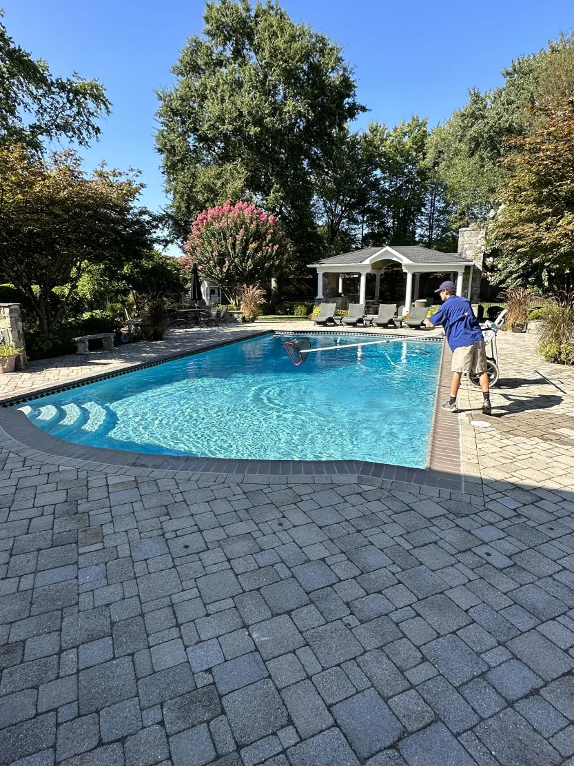 sub-Urban PASS worker cleaning pool