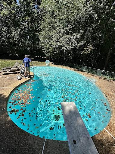 sub-Urban pool & spa LLC cleaning pool
